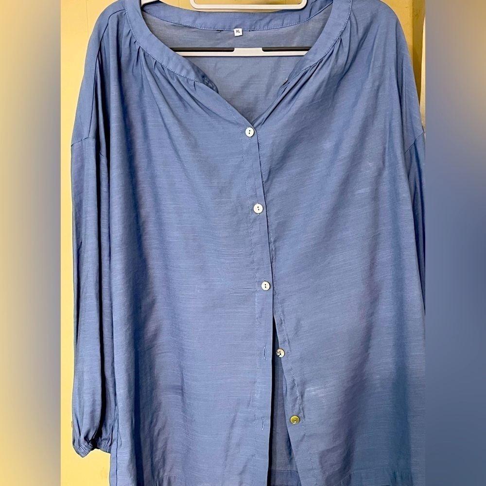 Women size XL Blue long sleeve button up loose fitting shirt. Gently used.